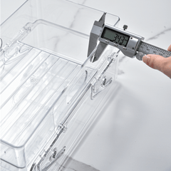 A Clear Plastic Refrigerator Organizer with Soda Water Dispenser And Beverage Rack - Designed for Fridges, Freezers, Pantries, Kitchens, Countertops, And Cabinets - Perfect Kitchen Accessory.