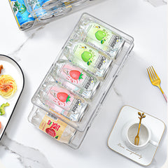 A Clear Plastic Refrigerator Organizer with Soda Water Dispenser And Beverage Rack - Designed for Fridges, Freezers, Pantries, Kitchens, Countertops, And Cabinets - Perfect Kitchen Accessory.